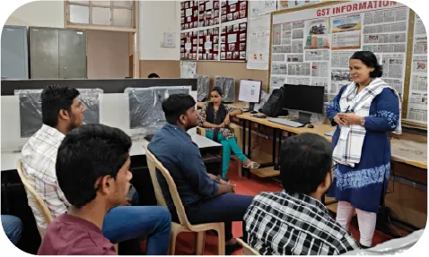 Students seated in a lab using desktop systems for practical accounting exercises